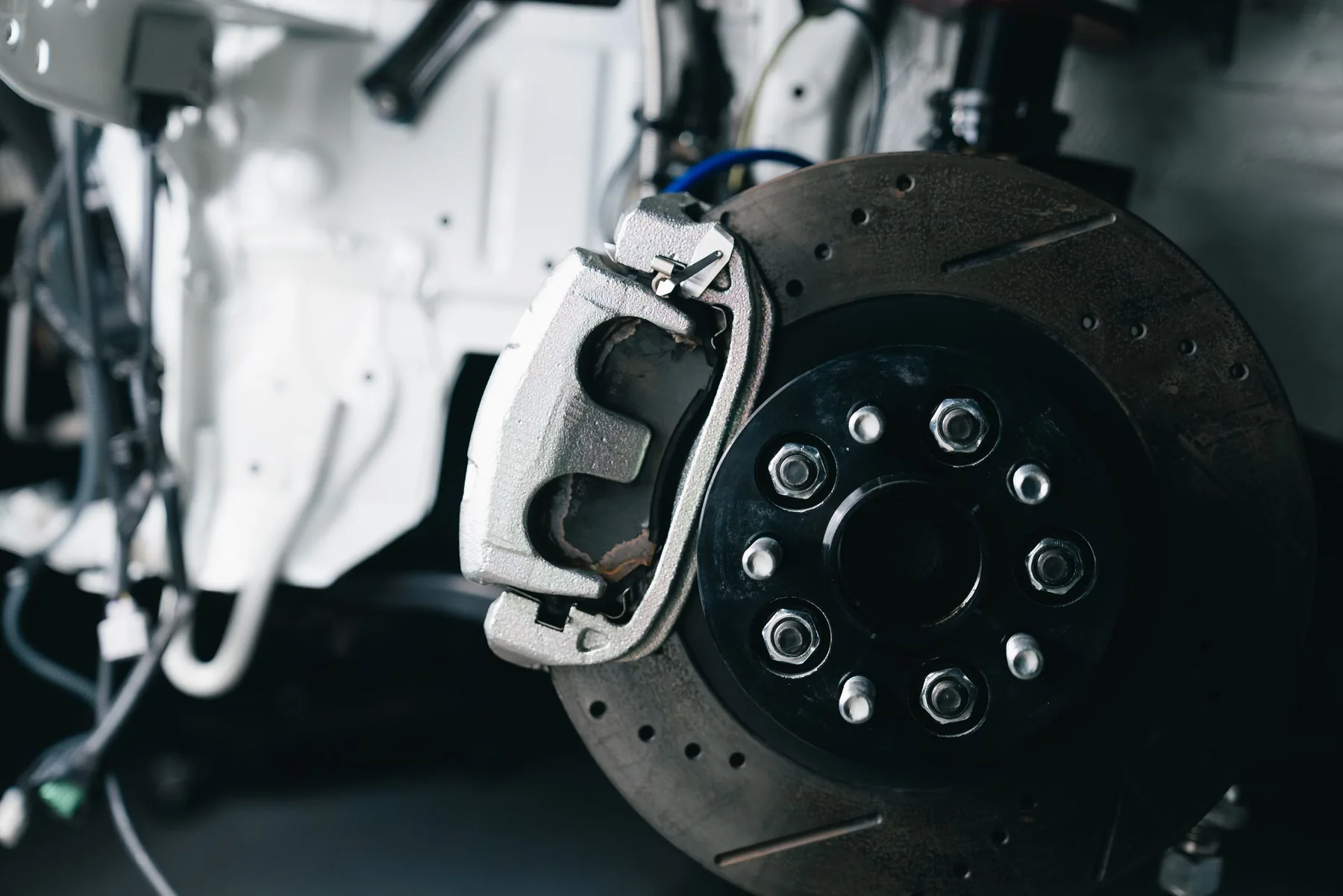 A brake disc and caliper with the wheel removed