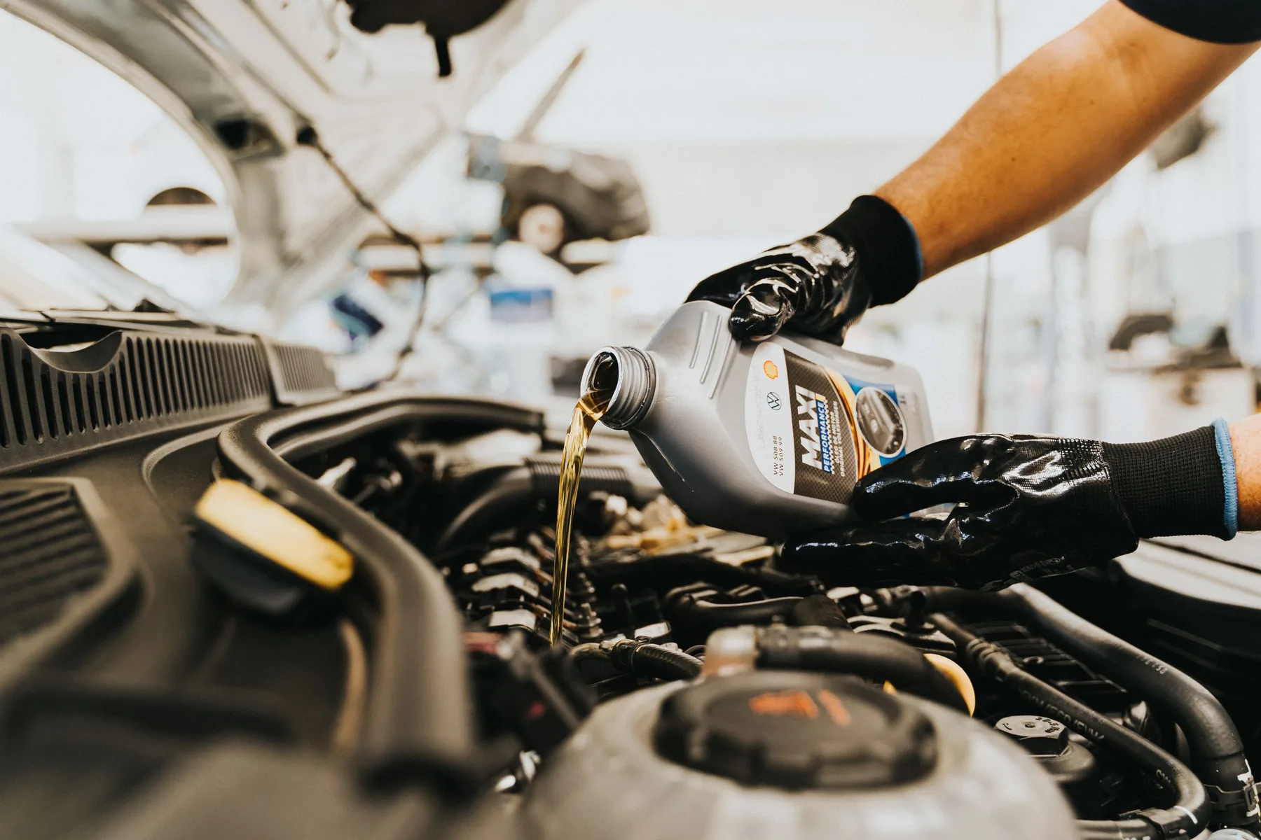 An oil change being carried out during a car service