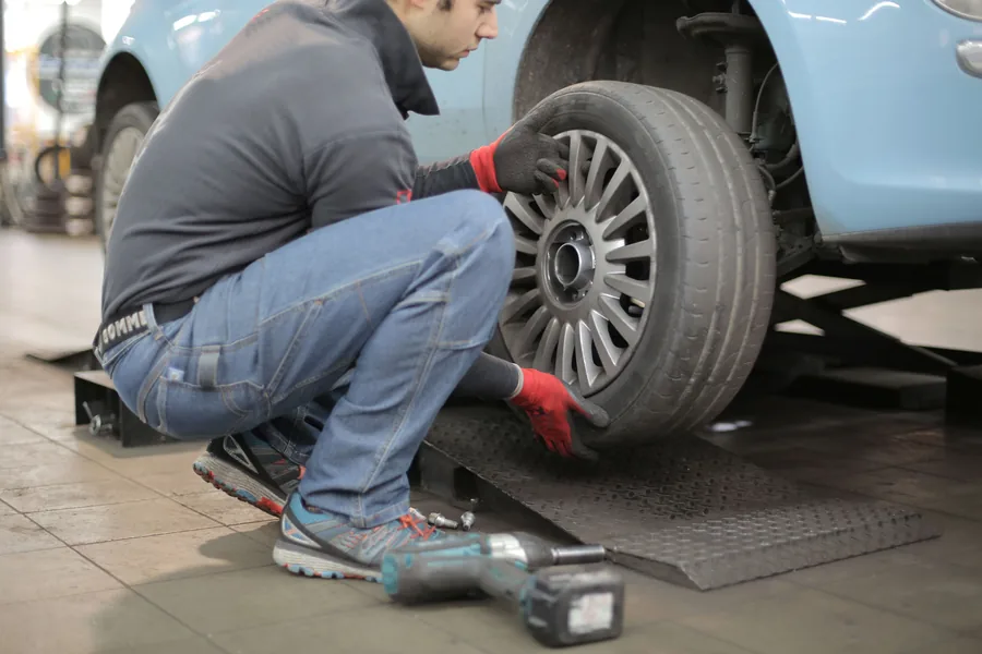 A wheel being refitted and torqued
